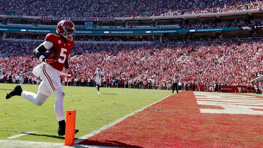 Alabama Crimson Tide wide receiver scores a touchdown