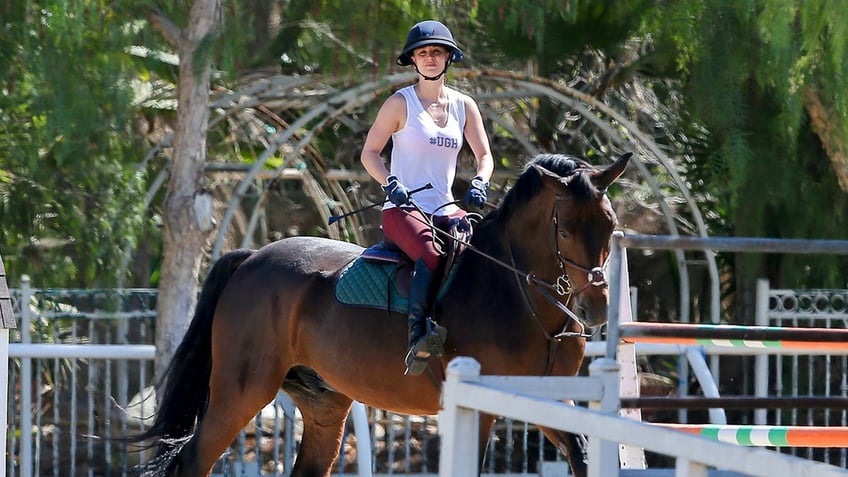 Kaley Cuoco show jumping