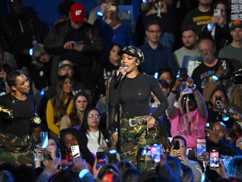 US rapper GloRilla (C) performs onstage during a "When We Vote We Win" campaign rally by U