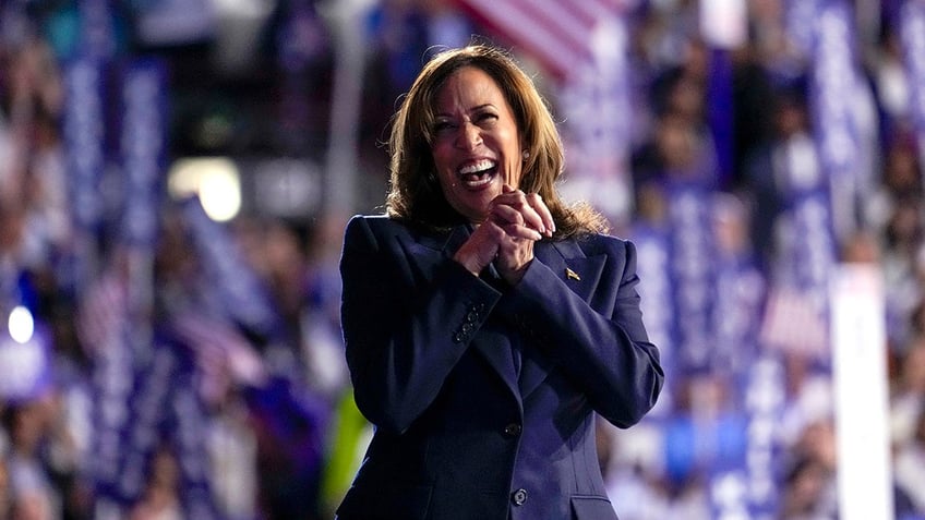 Harris laughing on stage at the DNC