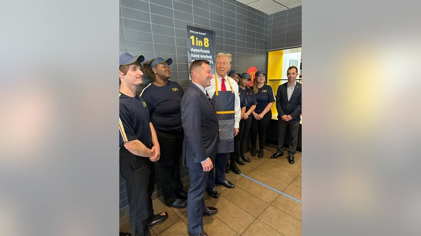 Former President Donald Trump, right, with Rep. Guy Reschenthaler, R-Pa., left, at a McDonald's in Pennsylvania. 