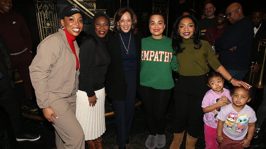 Kamala Harris stands with Broadway performers on Saturday. 