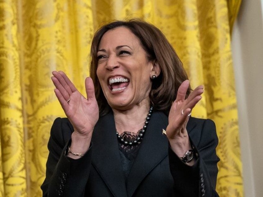 President Joe Biden and Vice President Kamala Harris react while high school senior and yo