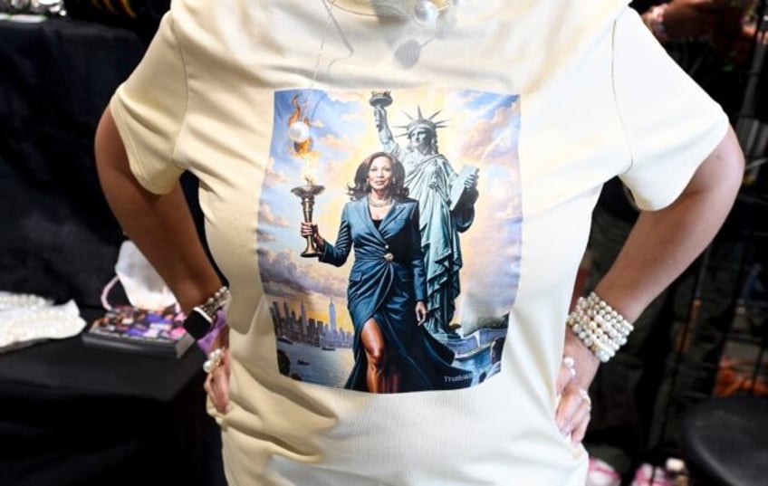 An attendee wears a Lady Liberty Kamala Harris T-shirt as memorabilia is for sale at the D