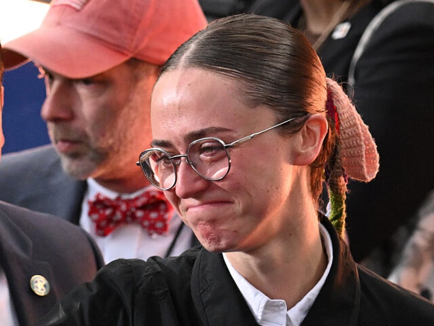 Ella Emhoff gets emotional as she reaches to hug someone after US Vice President Democrati