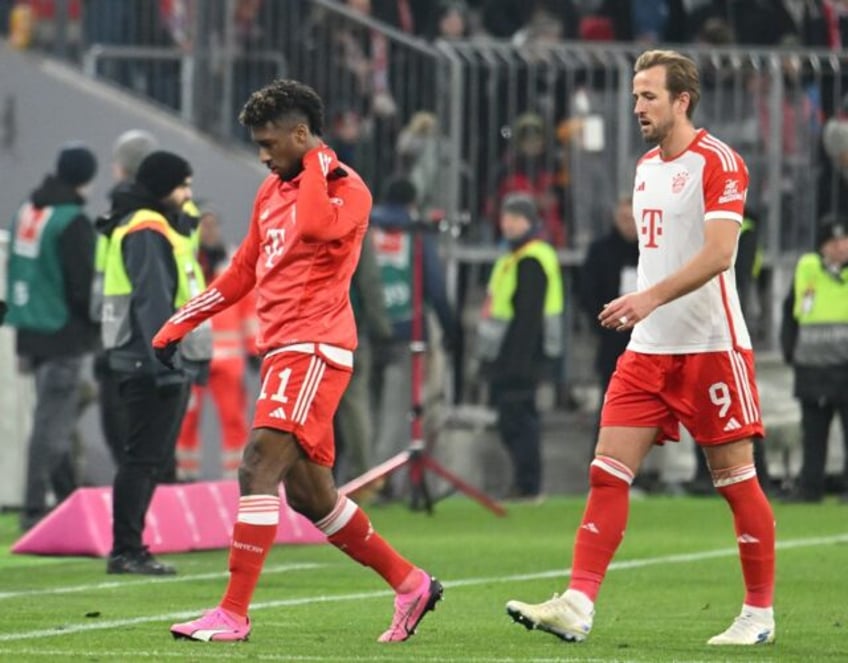 Bayern Munich's French winger Kingsley Coman (L) and English forward Harry Kane (R) are se