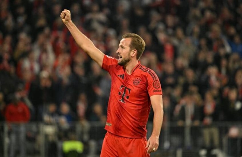 Bayern Munich forward Harry Kane celebrates after scoring his third goal in Saturday's win