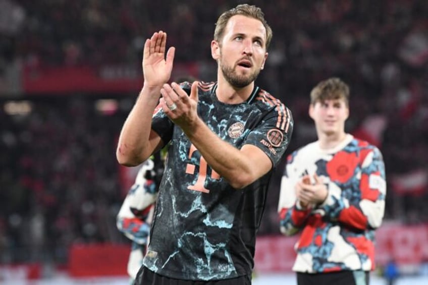 On target: Harry Kane celebrates after Bayern's win over Freiburg on Saturday