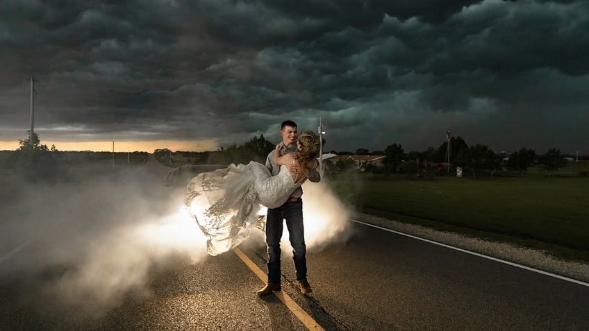 Kansas couple twirling in the street