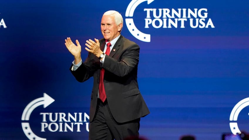 Former Vice President Mike Pence arrives on the stage before speaking at the Turning Point USA Student Action Summit, Tuesday, Dec. 22, 2020, in West Palm Beach, Fla. (AP Photo/Lynne Sladky)