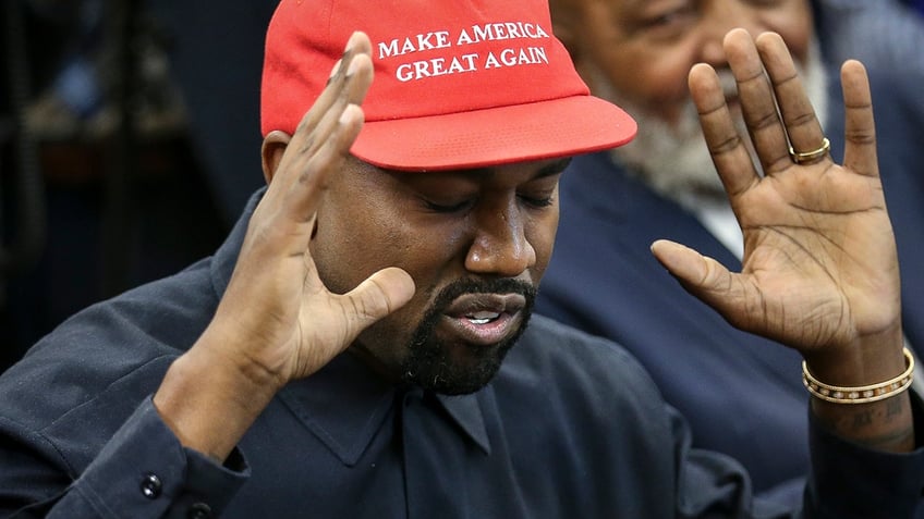 Ye wearing a Make America Great Again hat