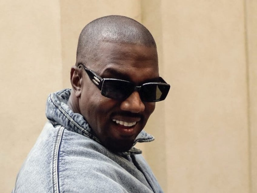 Kanye West attends the Kenzo fall-winter 22/23 men's collection, in Paris, Sunday, Jan. 23