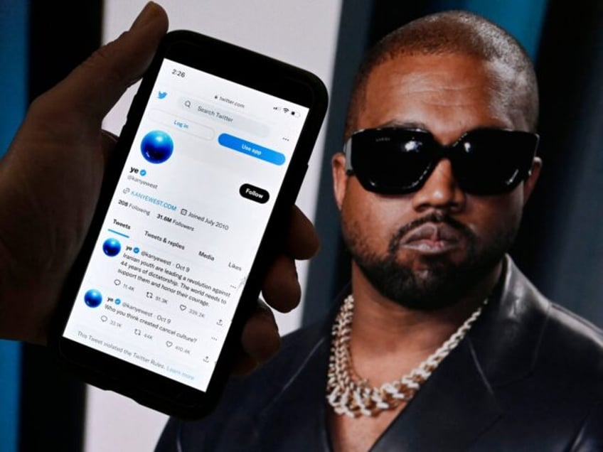 In this photo illustration, the Twitter account of Kanye West is displayed on a mobile pho