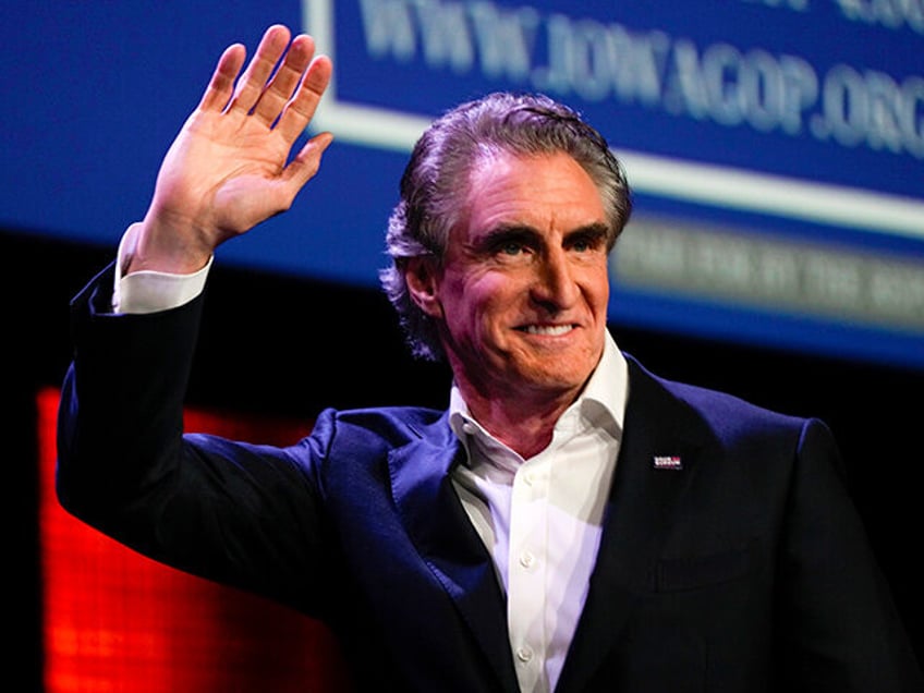 Republican presidential candidate North Dakota Gov. Doug Burgum waves at the Republican Pa