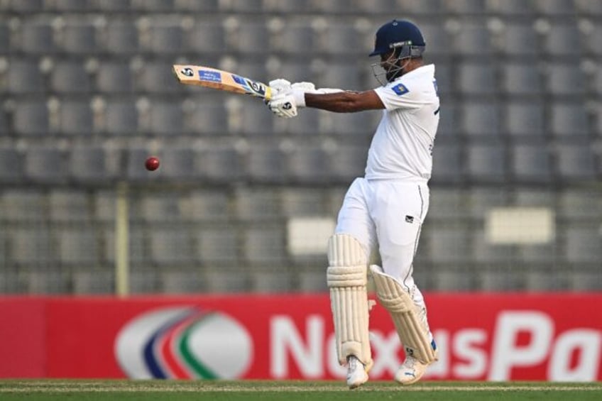 Sri Lanka's Dimuth Karunaratne held firm to score 52 off 101 balls before his dismissal of