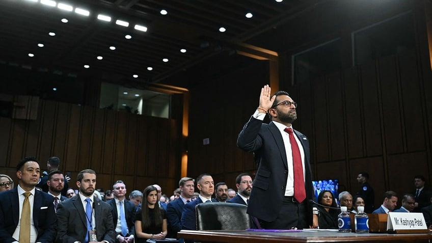 wide shot, Patel swearing in to testify at confirmation hearing