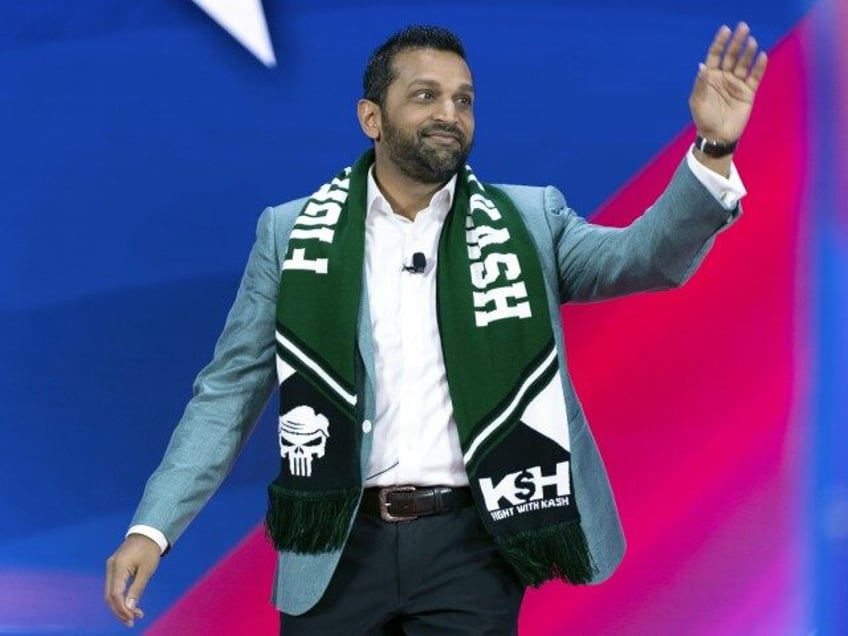 Former Pentagon Chief of Staff Kash Patel waves to the crowd as he speaks during the Conse