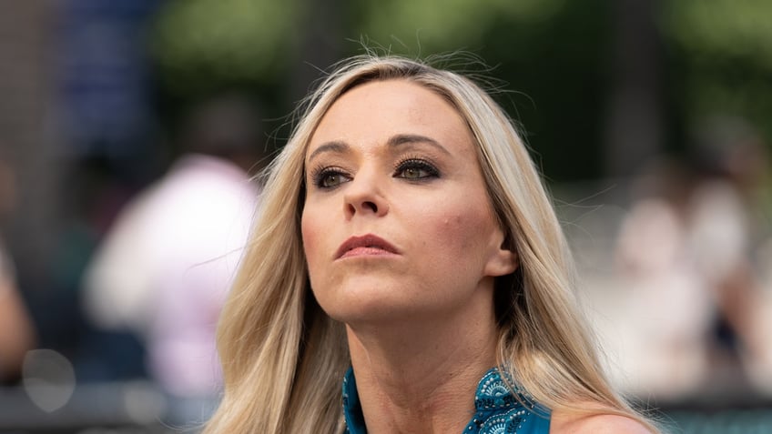 Kate Gosselin looking serious wearing a blue top