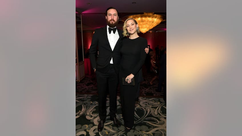 A photo of Danny Fujikawa and Kate Hudson