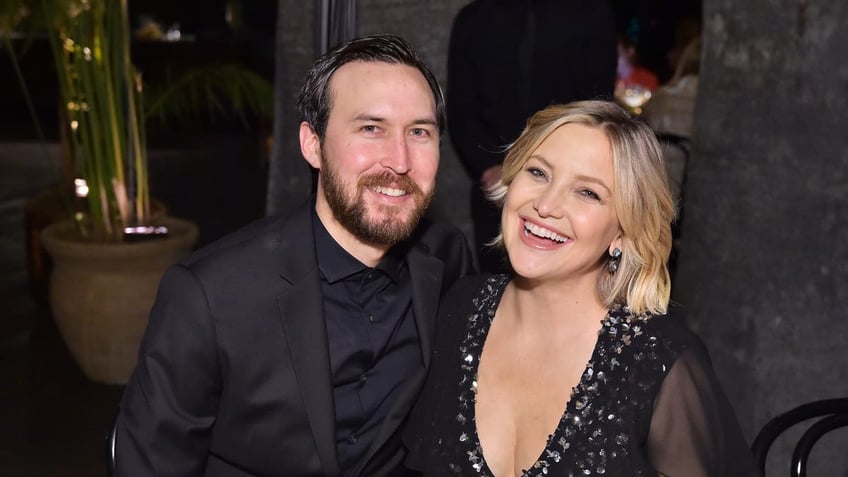 A photo of Danny Fujikawa and Kate Hudson