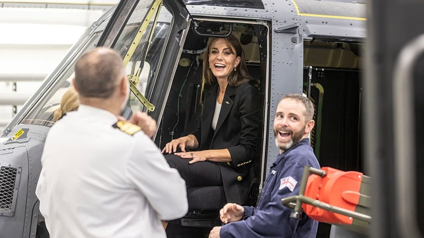 kate middleton braces for life vest mishap during first royal outing in new military role