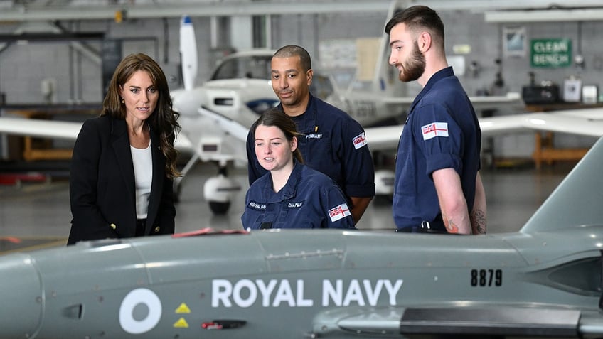kate middleton braces for life vest mishap during first royal outing in new military role
