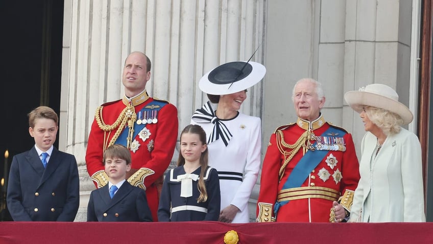 A photo of Prince William and Kate Middleton with their children and King Charles, Queen Camilla