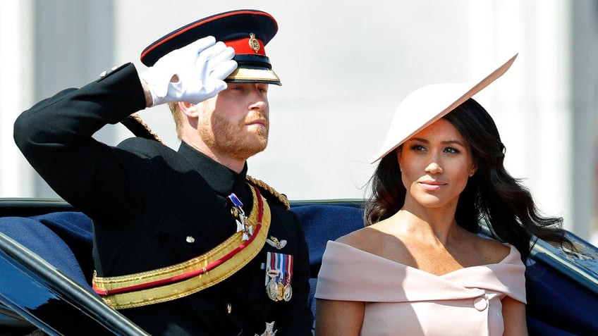 Prince Harry and Meghan Markle in a horse drawn carriage during Trooping the Colour