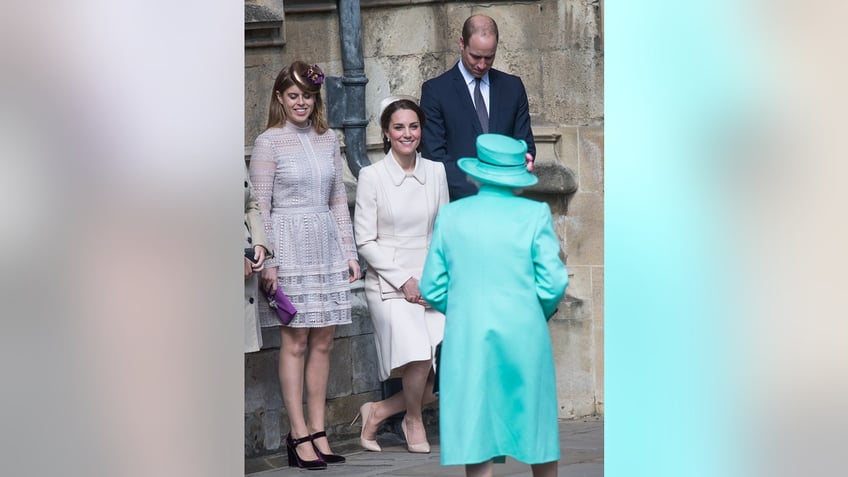 Kate Middleton giving a curtsy to Queen Elizabeth II