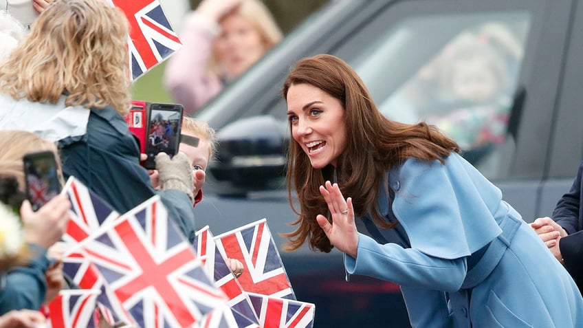 Kate Middleton waving to a crowd