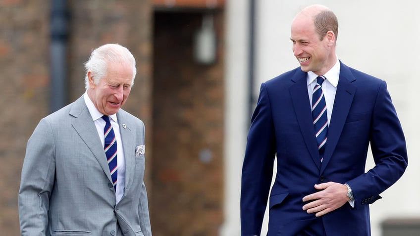 King Charles III and Prince William walking together