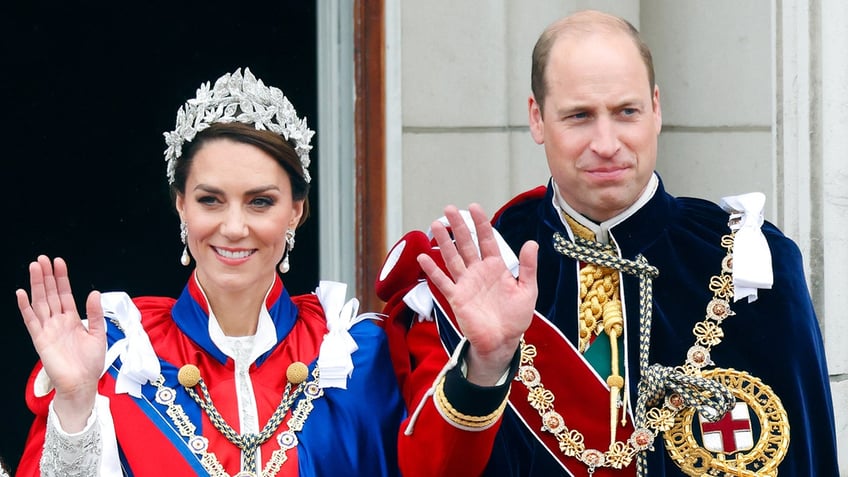 Kate Middleton and Prince William in royal regalia waving to the public.