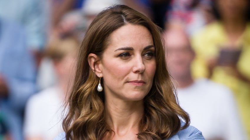 A close-up of Kate Middleton looking to her side