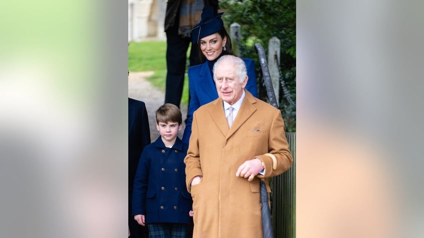 Kate Middleton in a blue coat walking with Prince Louis behind King Charles