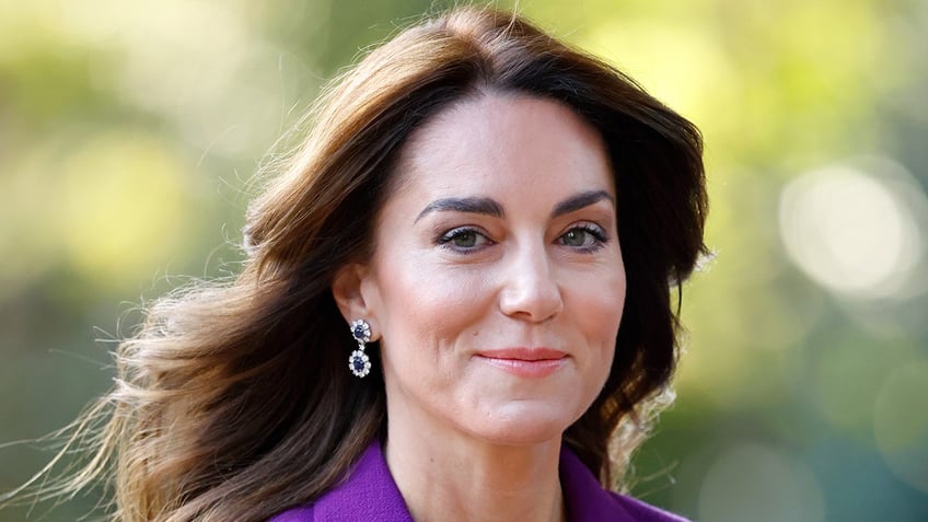 A close-up of Kate wearing a purple blazer