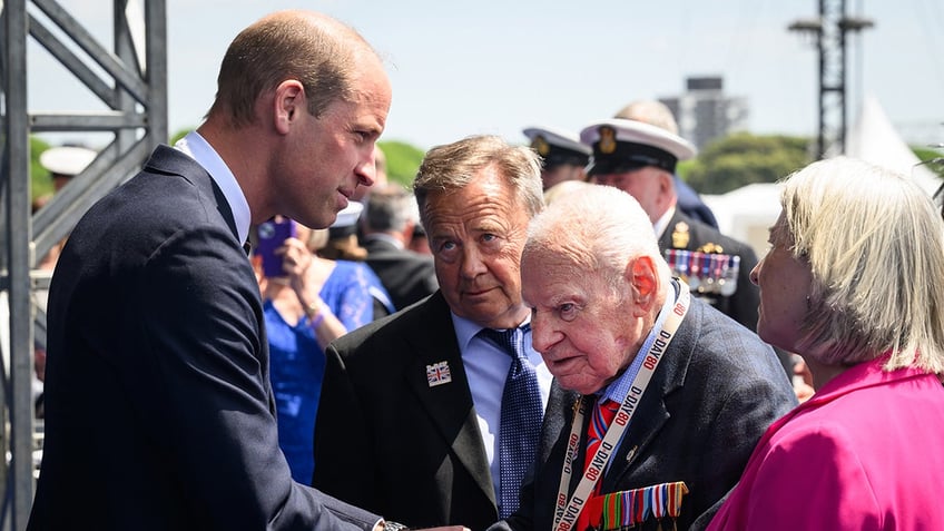 Prince William greeting a veteran