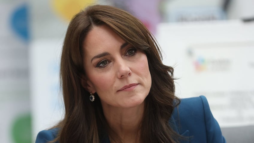 Kate Middleton wears a blue suit at charity event