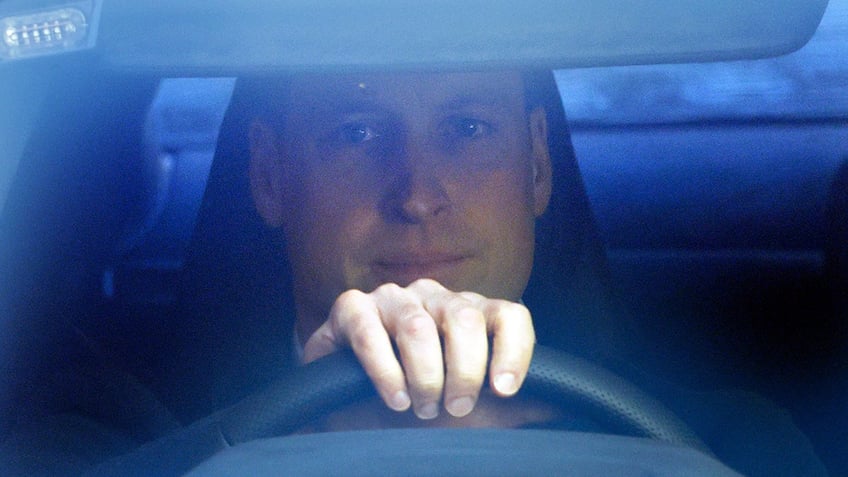 A close-up of Prince William driving
