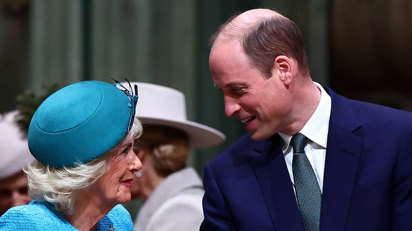Prince William speaking with Queen Camilla