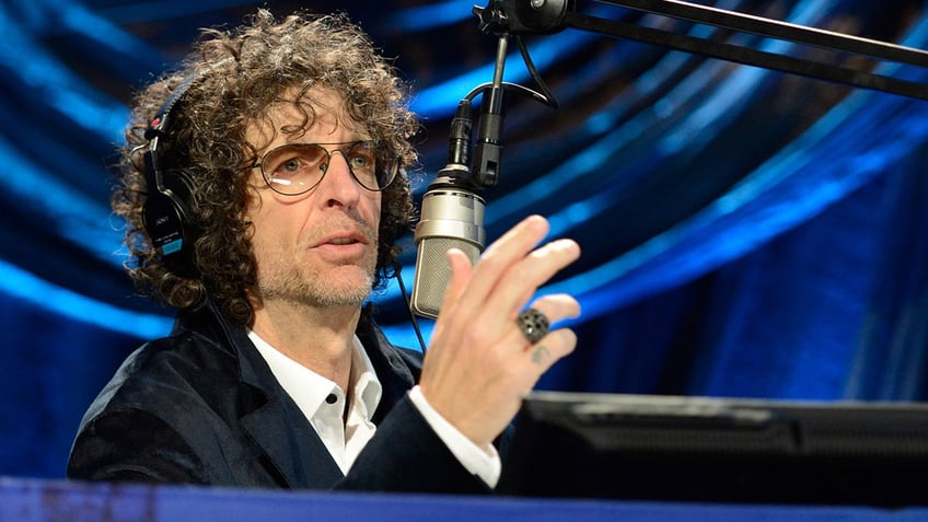 Howard Stern speaking to a mic