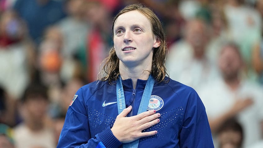 Katie Ledecky hand over heart