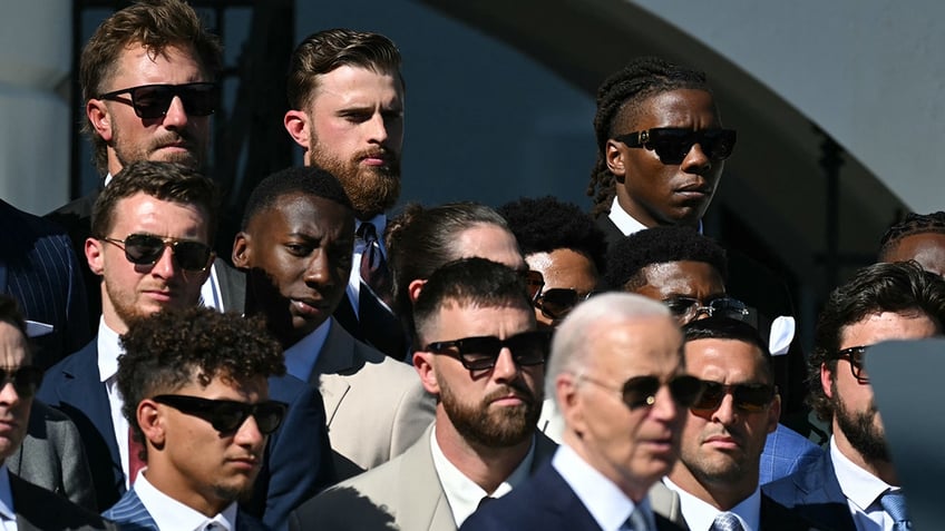 Harrison Butker stands with his team while meeting President Joe Biden at the White House