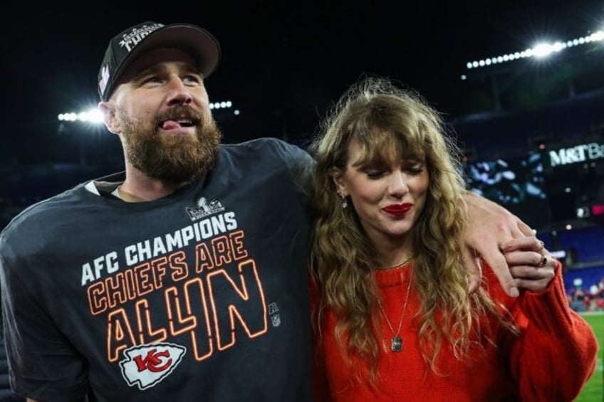 Travis Kelce of the Kansas City Chiefs celebrates with Taylor Swift after defeating the Ba