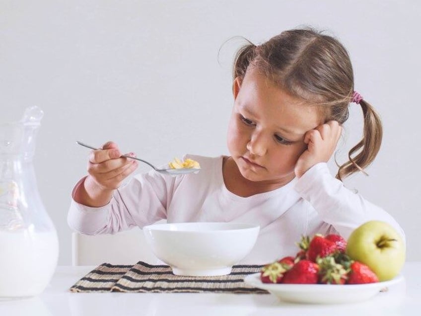 child eating cereal