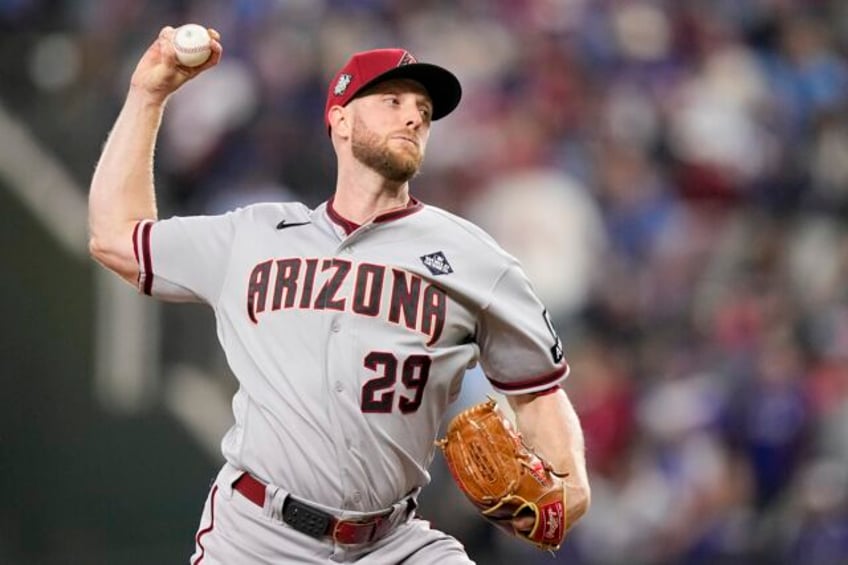 kelly dominates on mound as diamondbacks bounce back to rout rangers 9 1 and tie world series 1 all