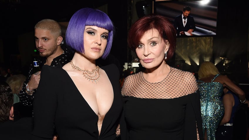 Kelly Osbourne and Sharon Osbourne posing together