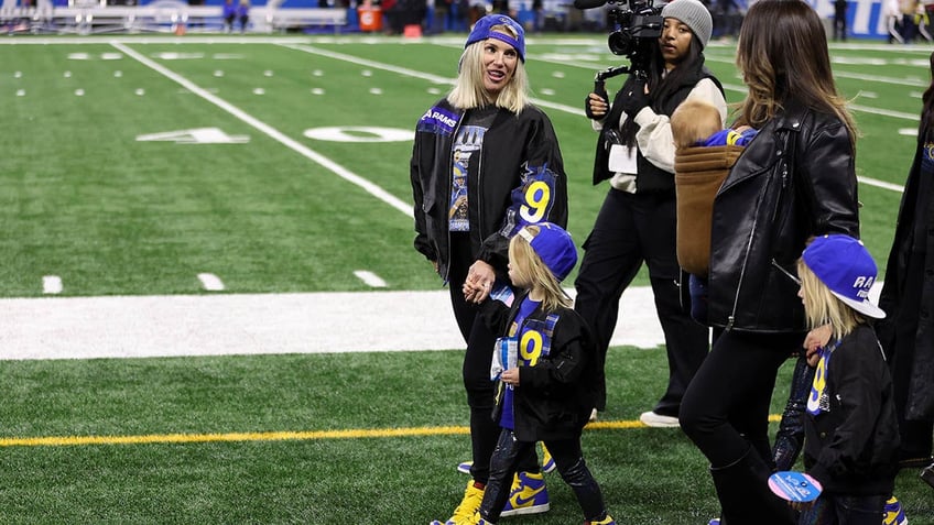 Kelly Stafford walks with her children