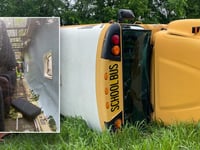 Kentucky school bus flips on its side with 23 children inside