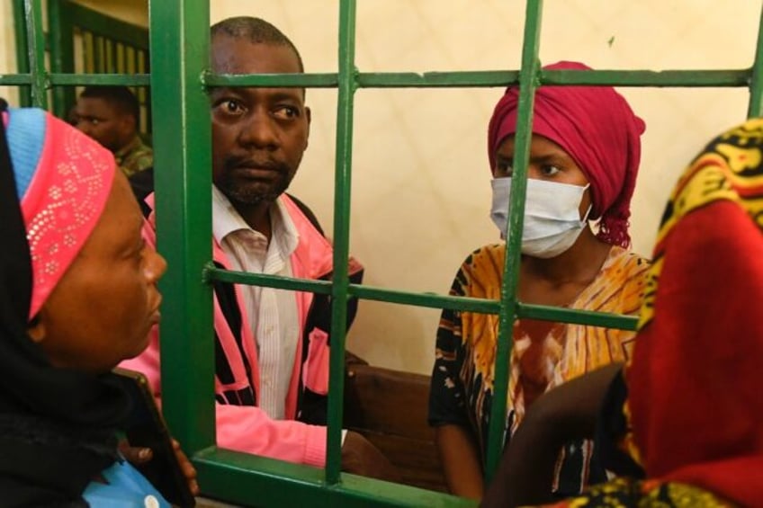 Paul Nthenge Mackenzie (second L) was arrested in April after bodies were discovered in the Shakahola forest near the Indian Ocean