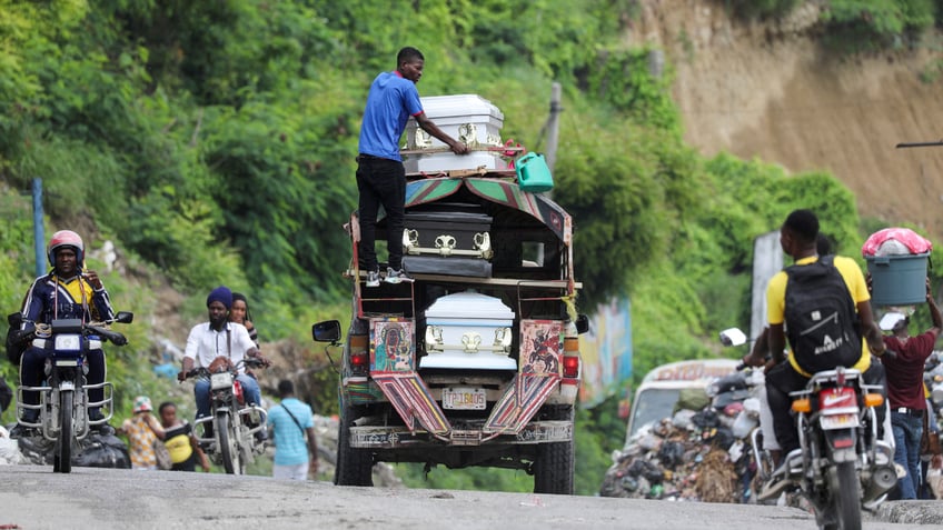 Truck transports caskets